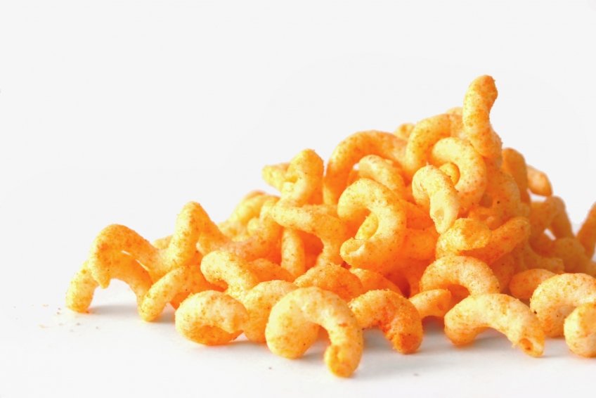 a pile of cheetos or ers is sitting on the table