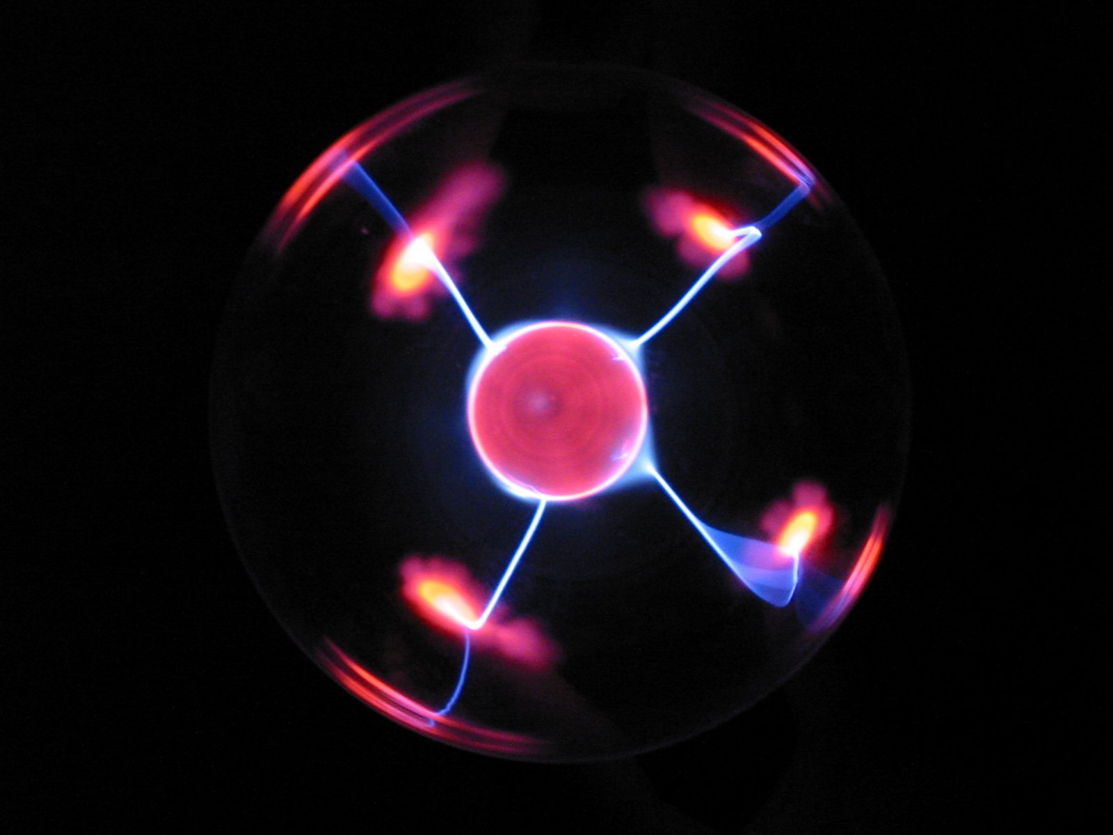 some glowing things in a black and red ball