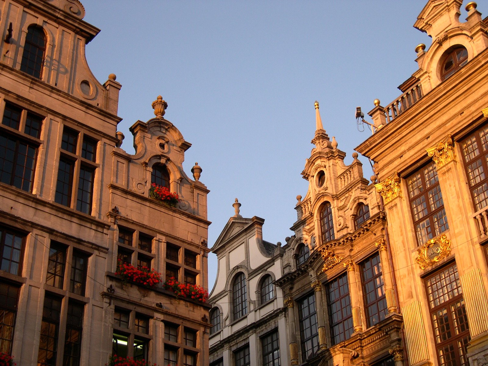 two big buildings with flowers on each floor