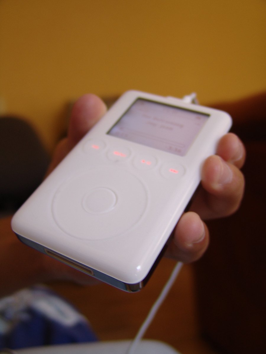 a person holding an ipod in their hand