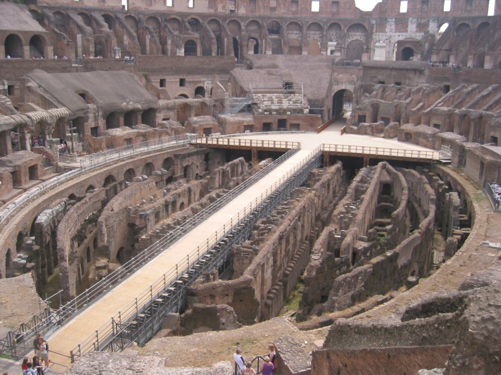 a man standing on a ramp inside of a large stone structure