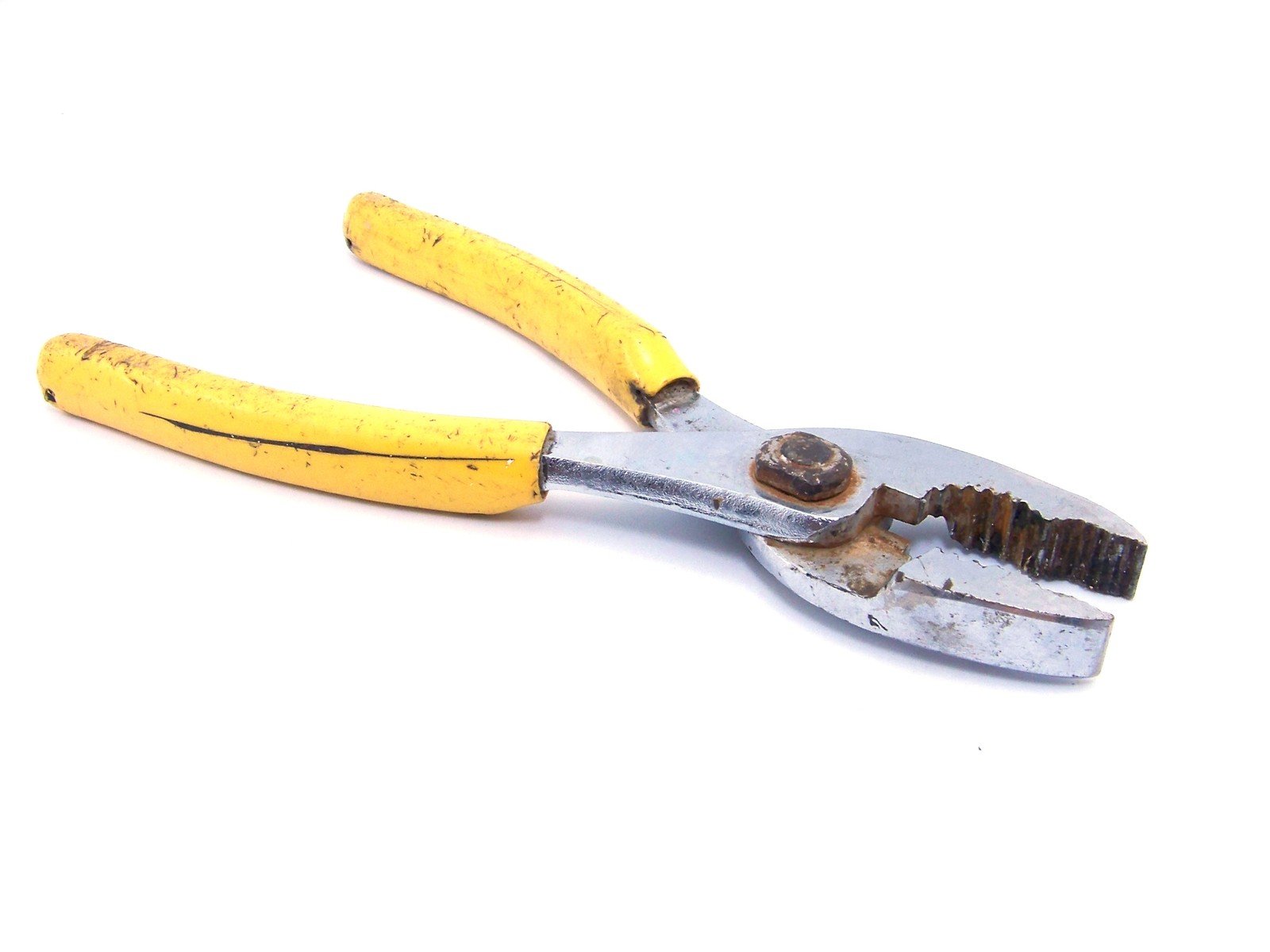 a pair of pliers with yellow handles laying on top of each other