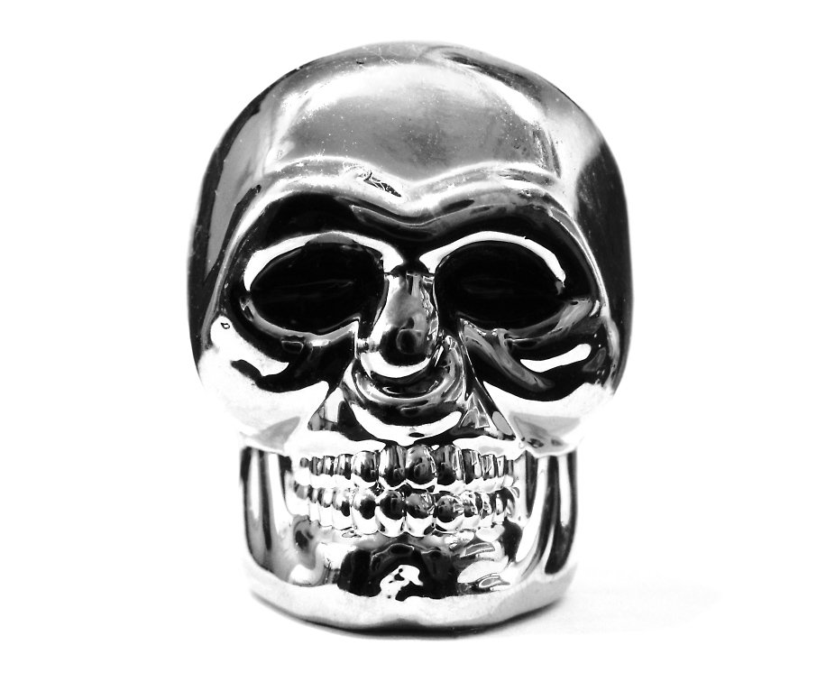 a large silver skull with two open eyes