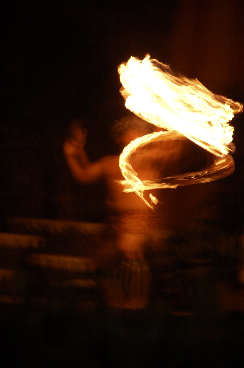 a blurry fire art po shows a figure holding a frisbee