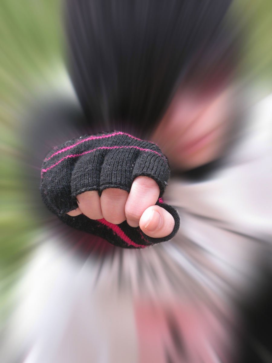 a blurry po of a person wearing gloves