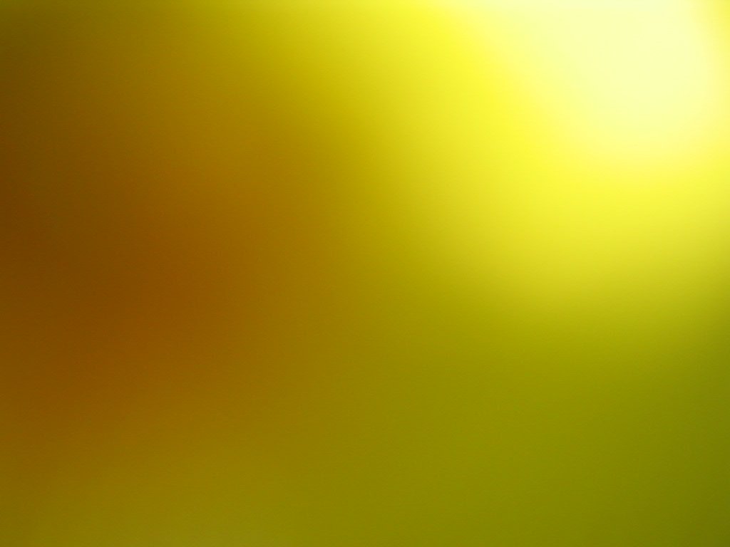 a yellow background that is blurry as the light turns on