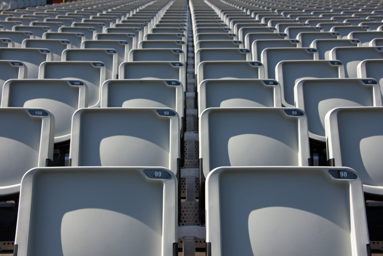 rows of empty seats are shown with no people