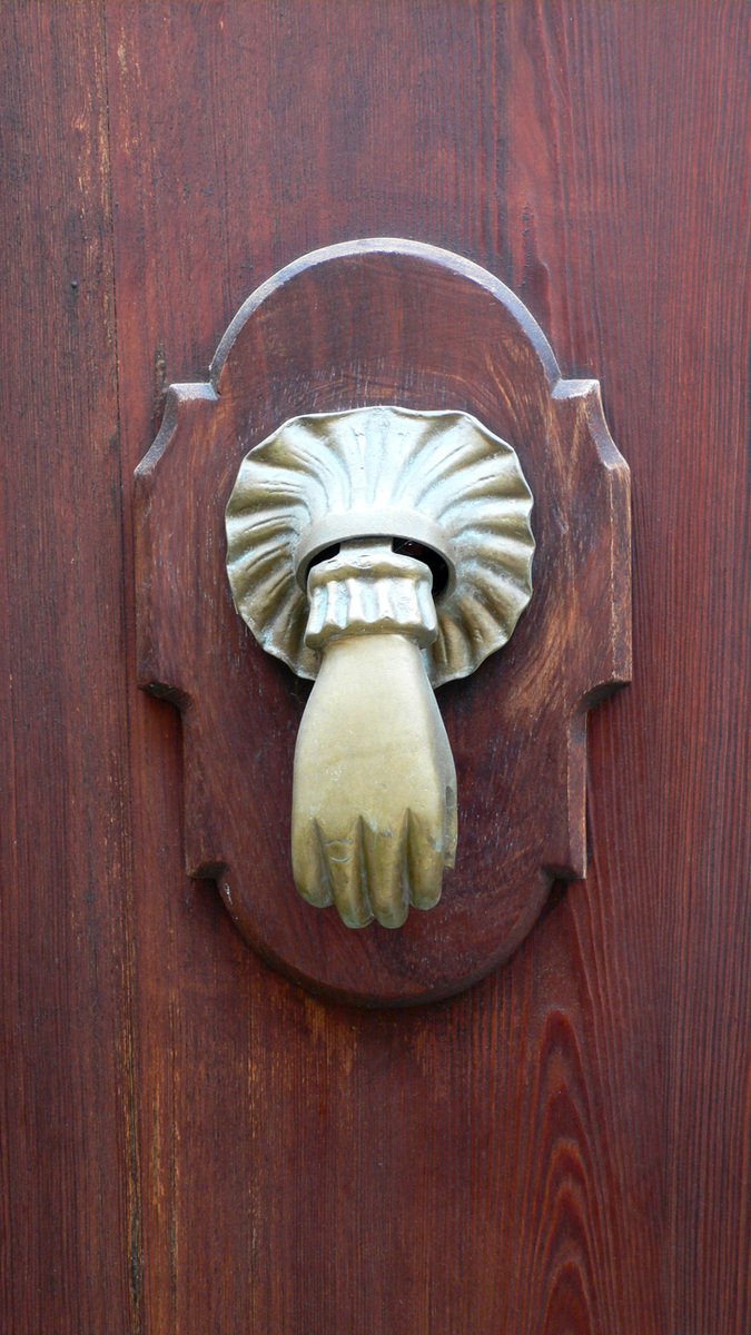 a close up of a metal handle on a door