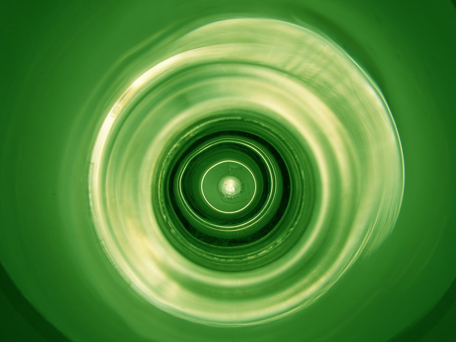 the reflection of a green light and its center being spinning