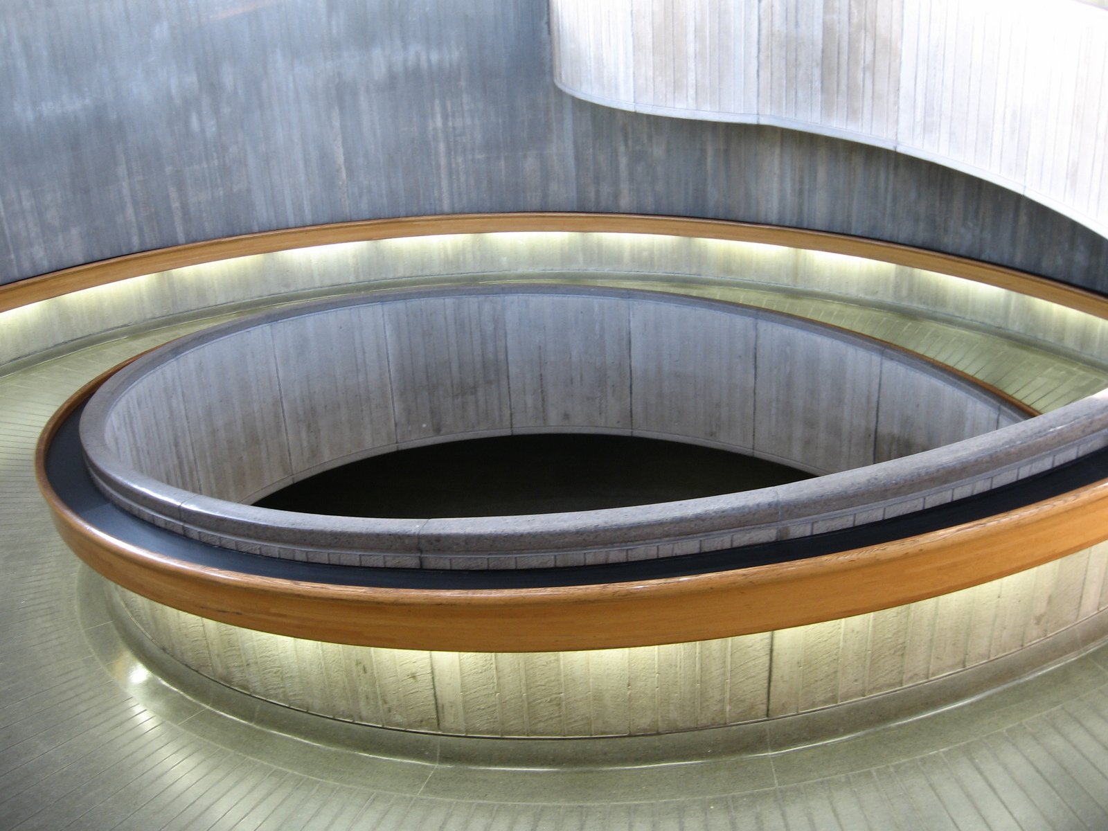 round shaped curved bench in a large silver tunnel