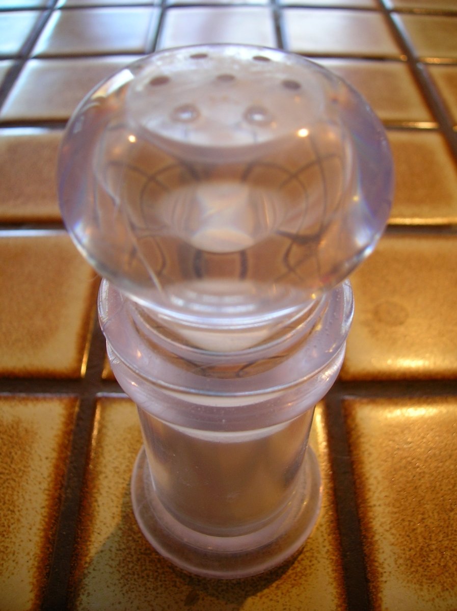 a clear object sitting on a tiled floor
