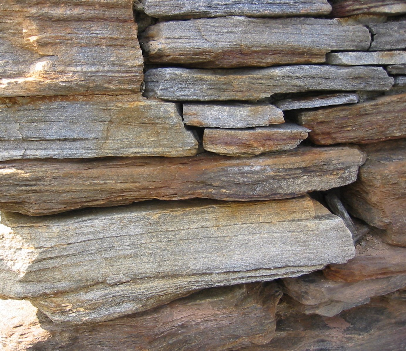 rocks piled on each other in a wall