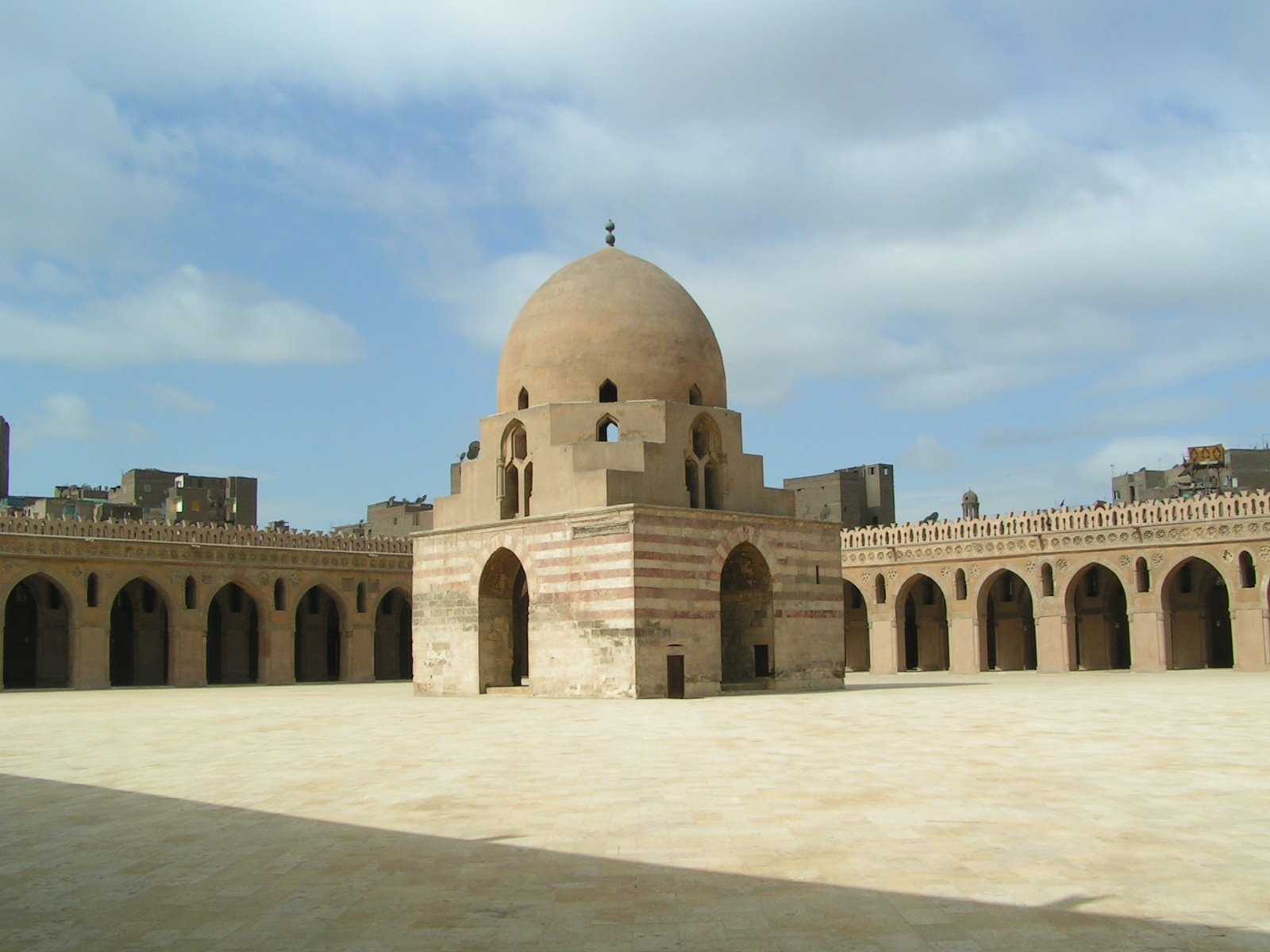 a large, well - manicured courtyard sits in the middle of a desert