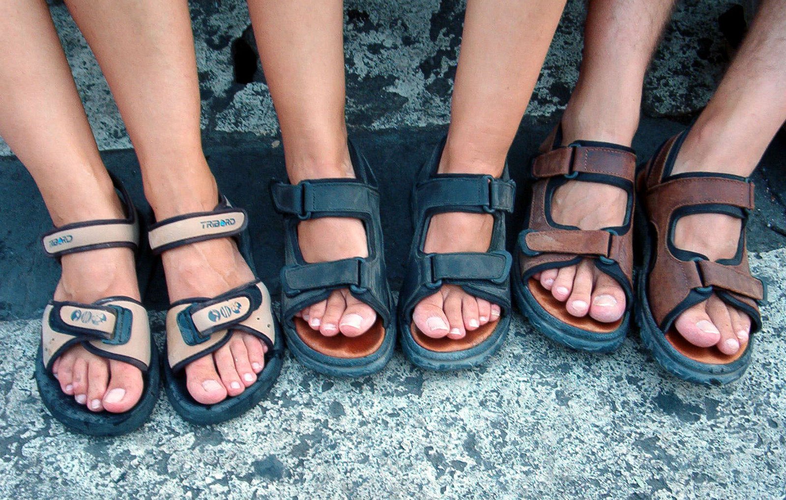 four different pairs of sandals that are next to each other