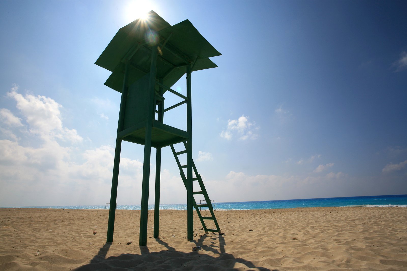 a lifeguard tower that has a ladder to access it
