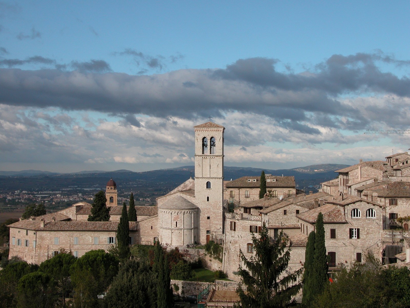 buildings with bell towers sit in an area of stone