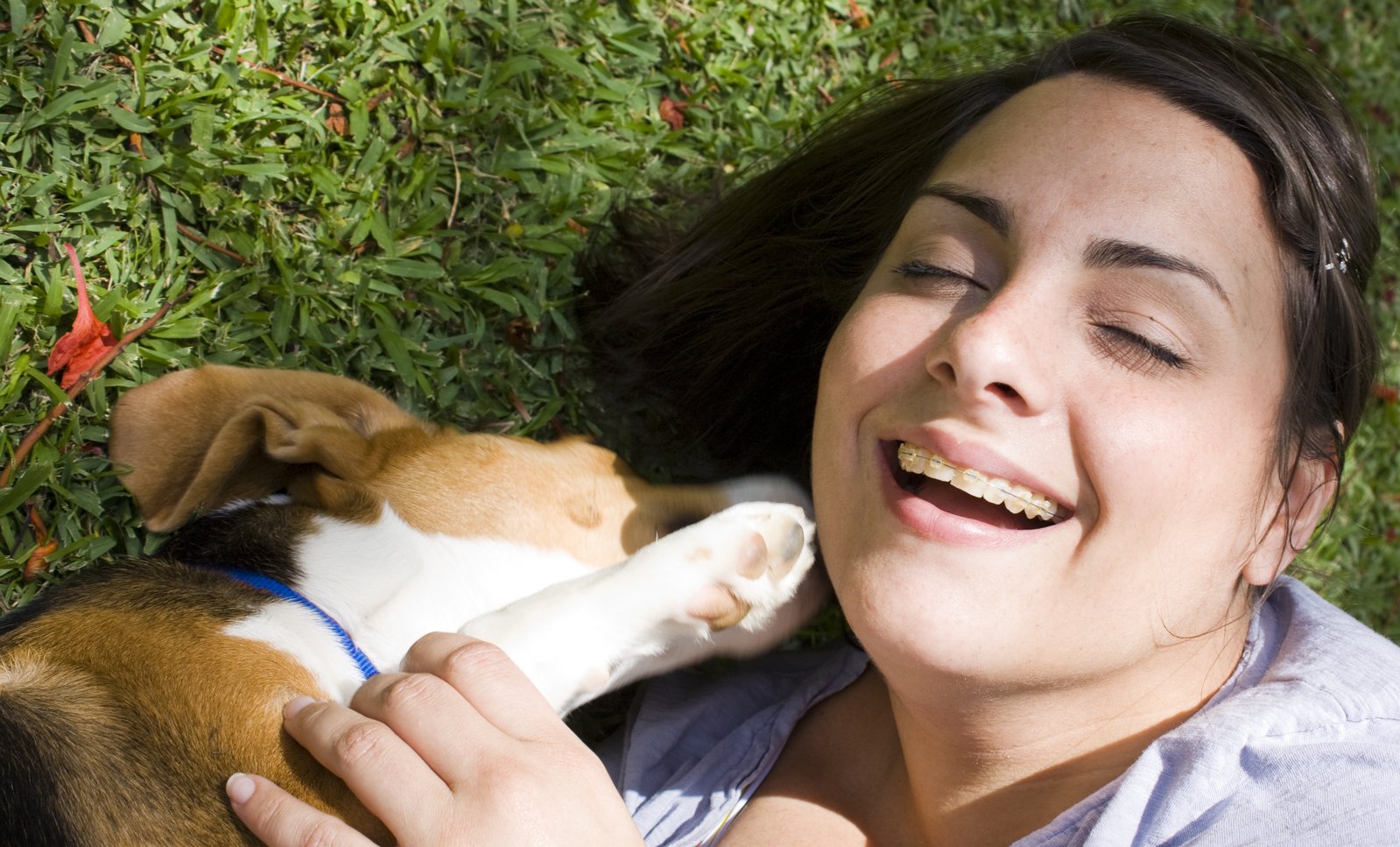 the lady is taking her dog for a nap