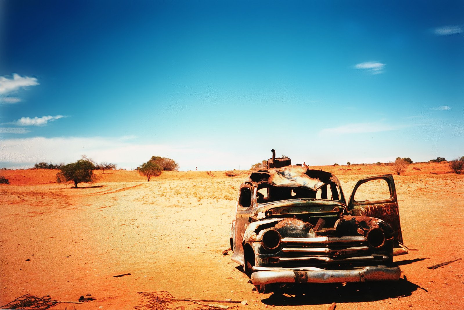 an old pickup truck in the desert