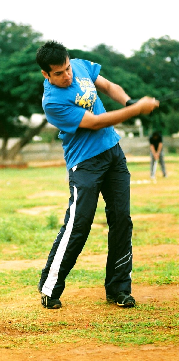 a man swinging a bat on a field