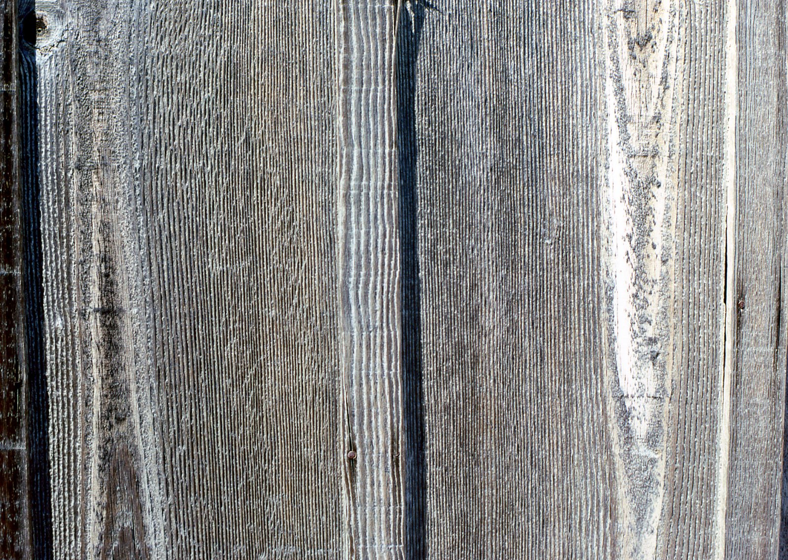 an old weathered wood surface with little rust