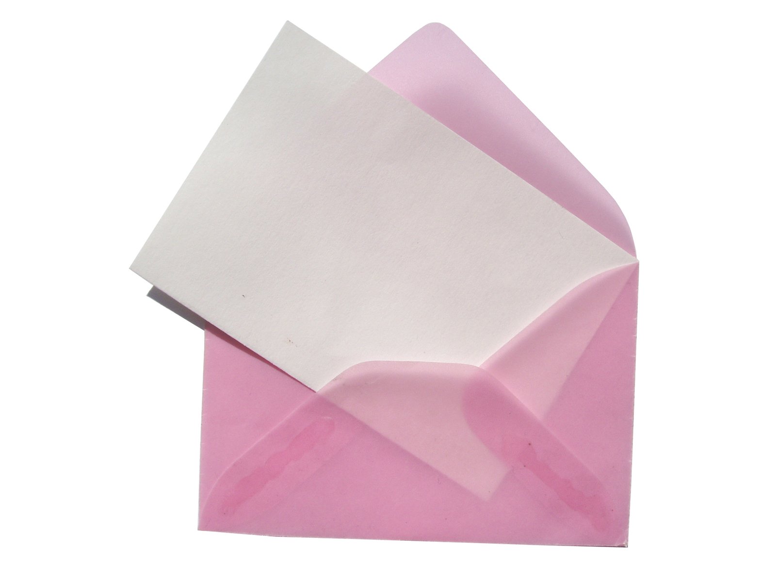 a piece of paper sitting in front of a pink envelope