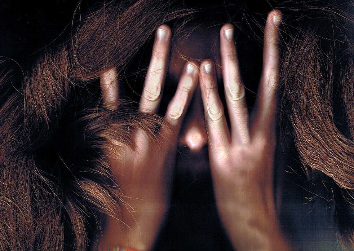 a poster of a woman covering her eyes and hands with different makeup