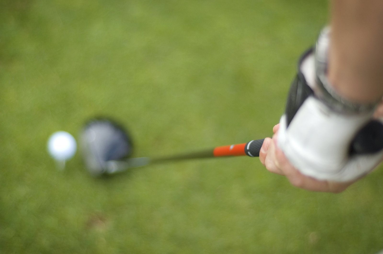 a person taking a swing at a golf ball