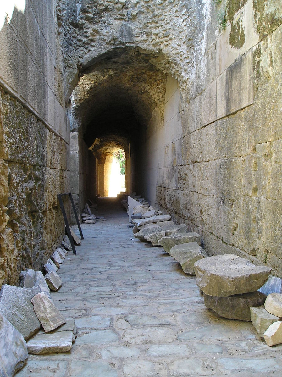 a stone lined tunnel that appears to be surrounded by rocks