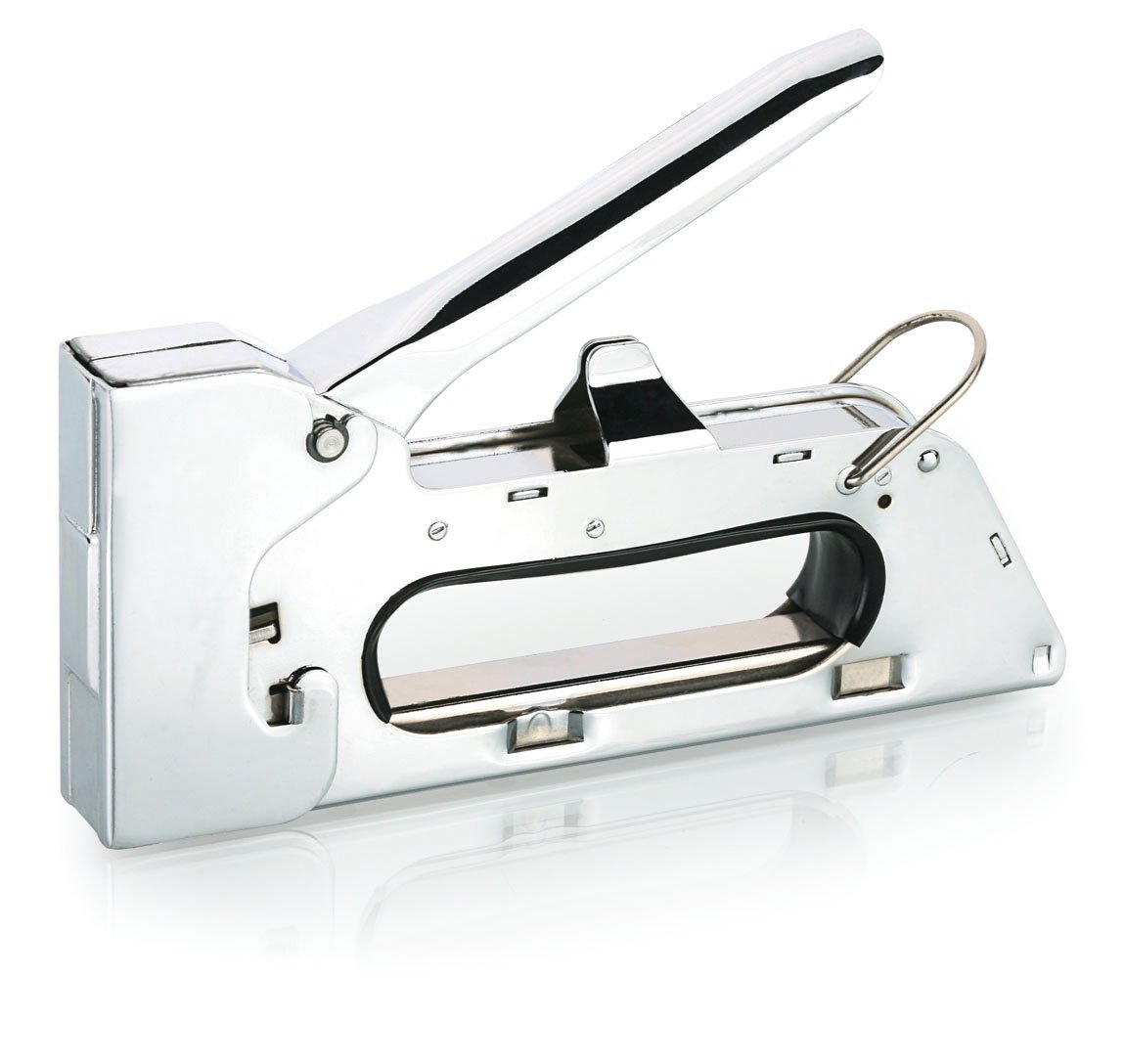 a white and black scissors are on top of a stapler
