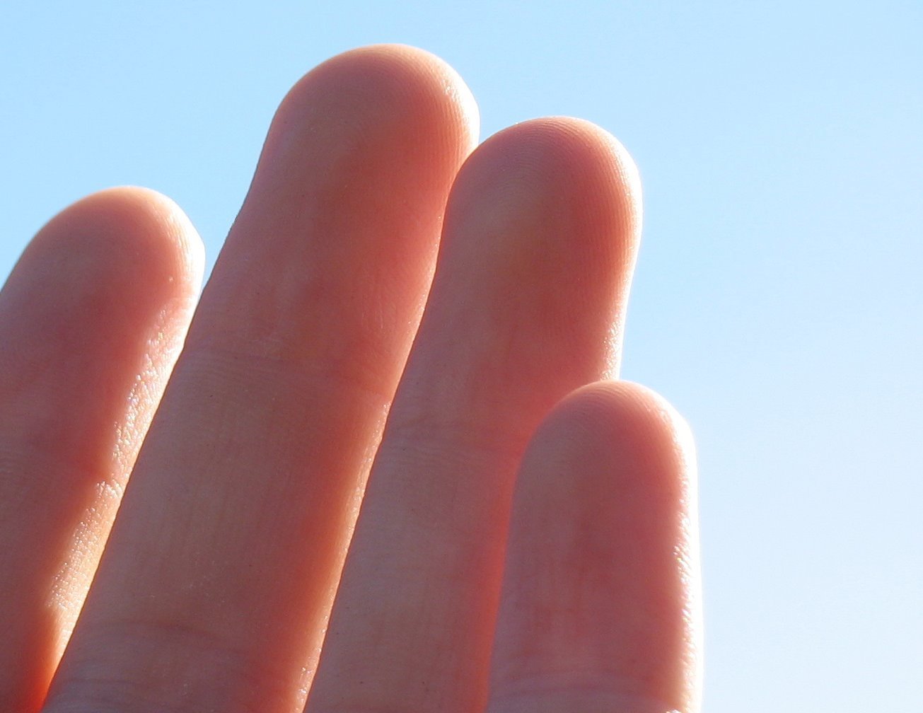 a close up image of some fingers holding soing