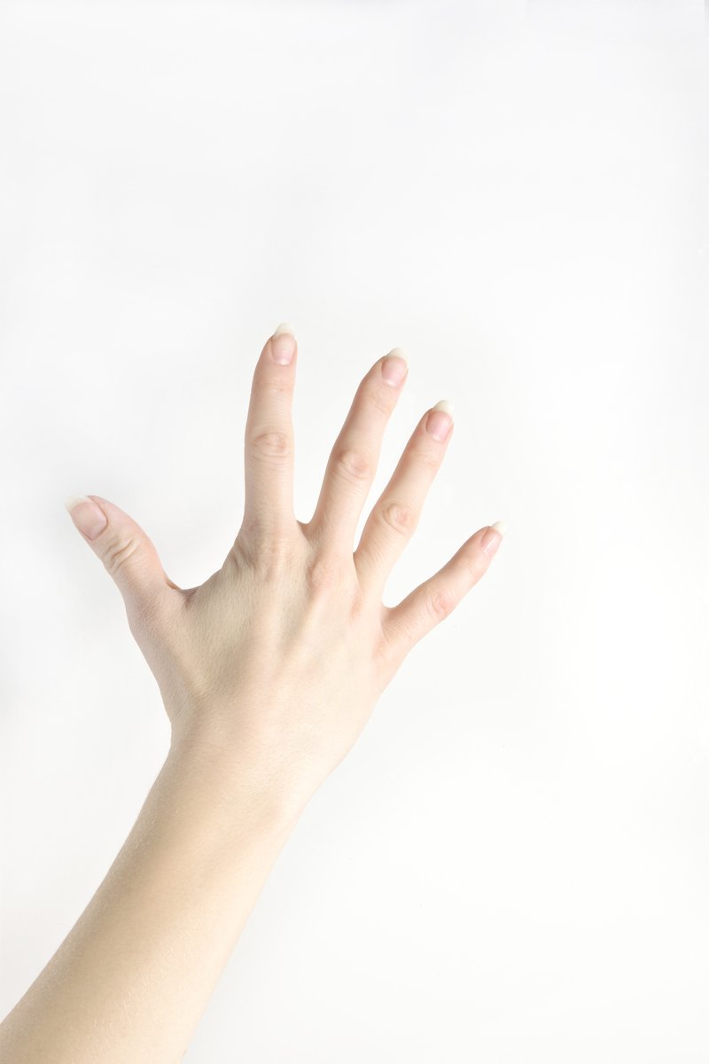 a hand with a finger extended in the air