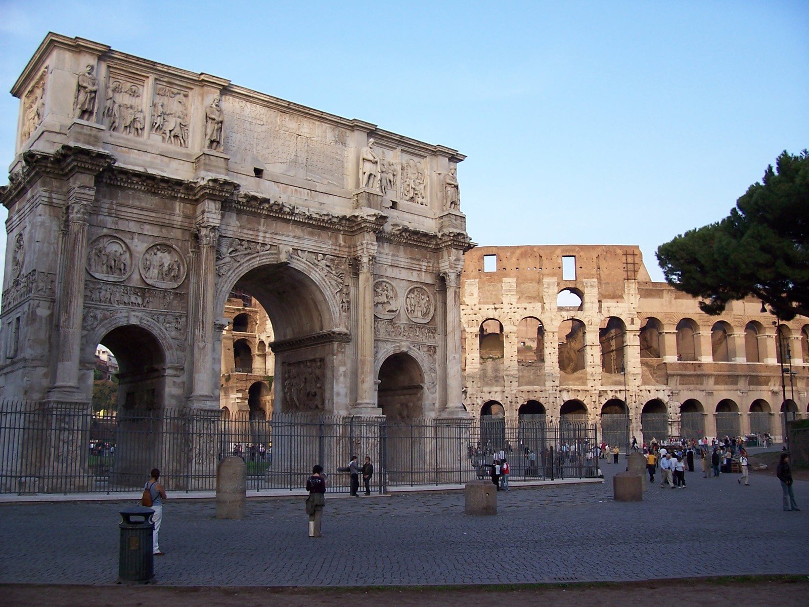 many people are standing around outside of a building