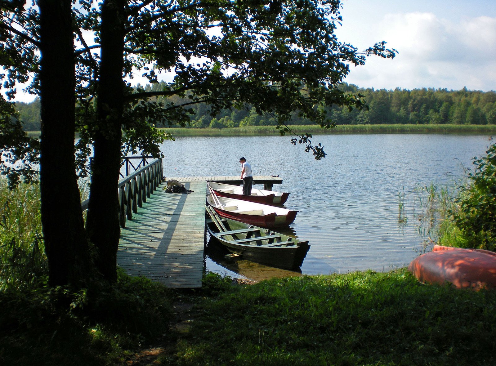 two boats on a dock near a body of water