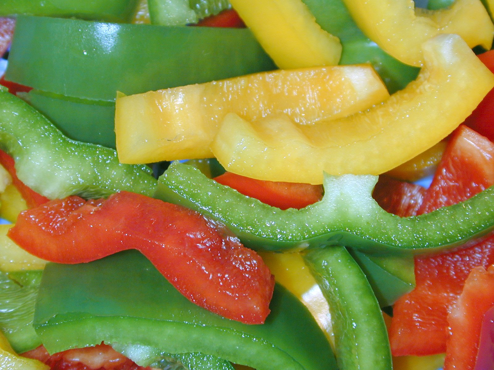 there is an assortment of different colored peppers