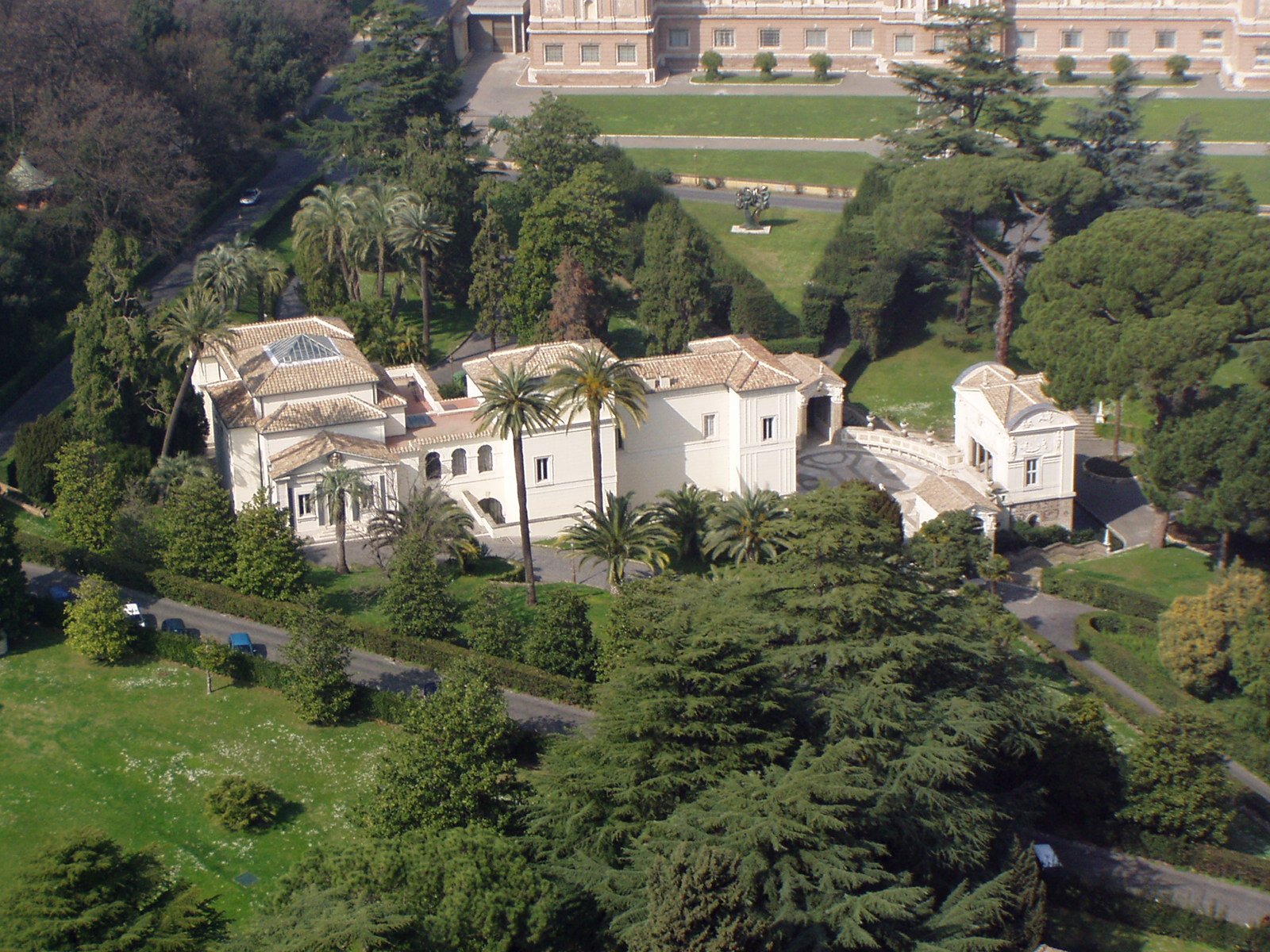an aerial view of an estate in the middle of a forest