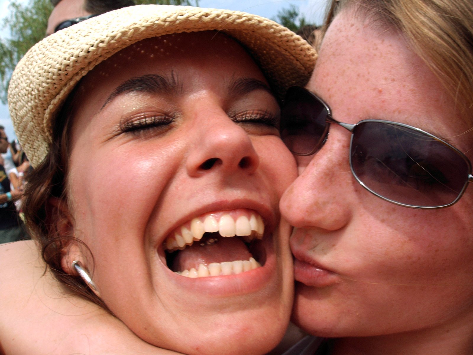 two women smiling while emcing each other