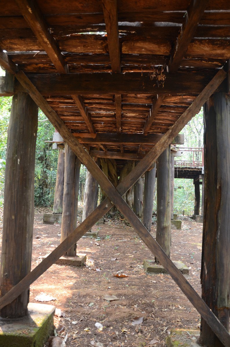 a wooden structure that is under some kind of structure