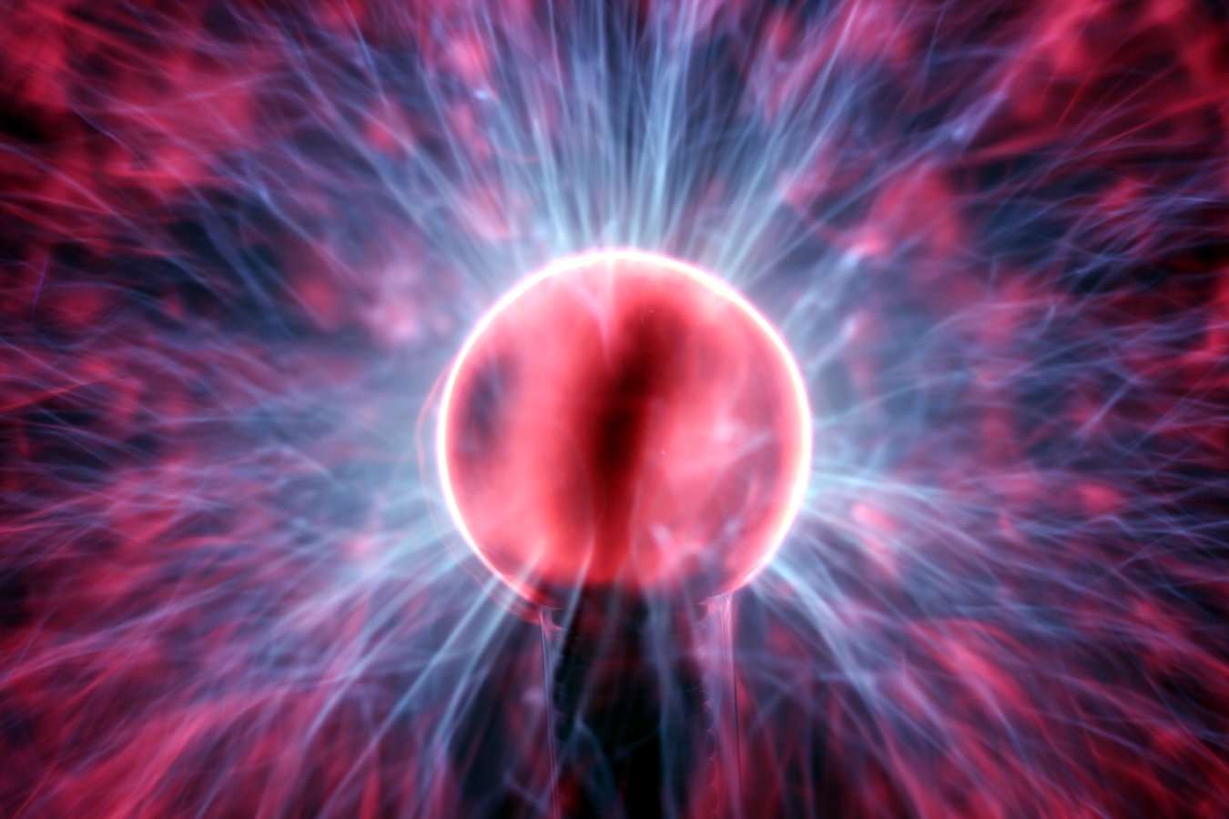 a red ball with blue smoke in the center