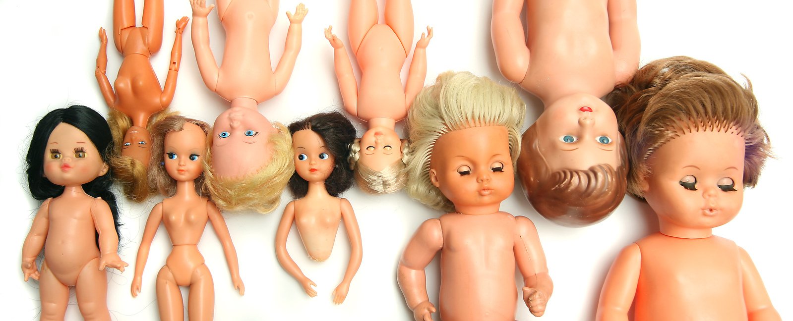 a group of dolls that are laying on top of each other