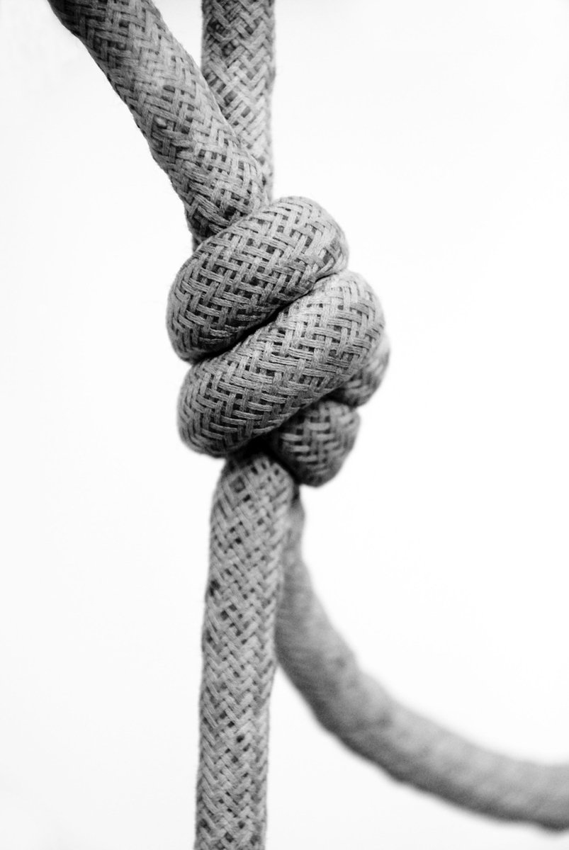 this knot is hanging by a hook on a ship