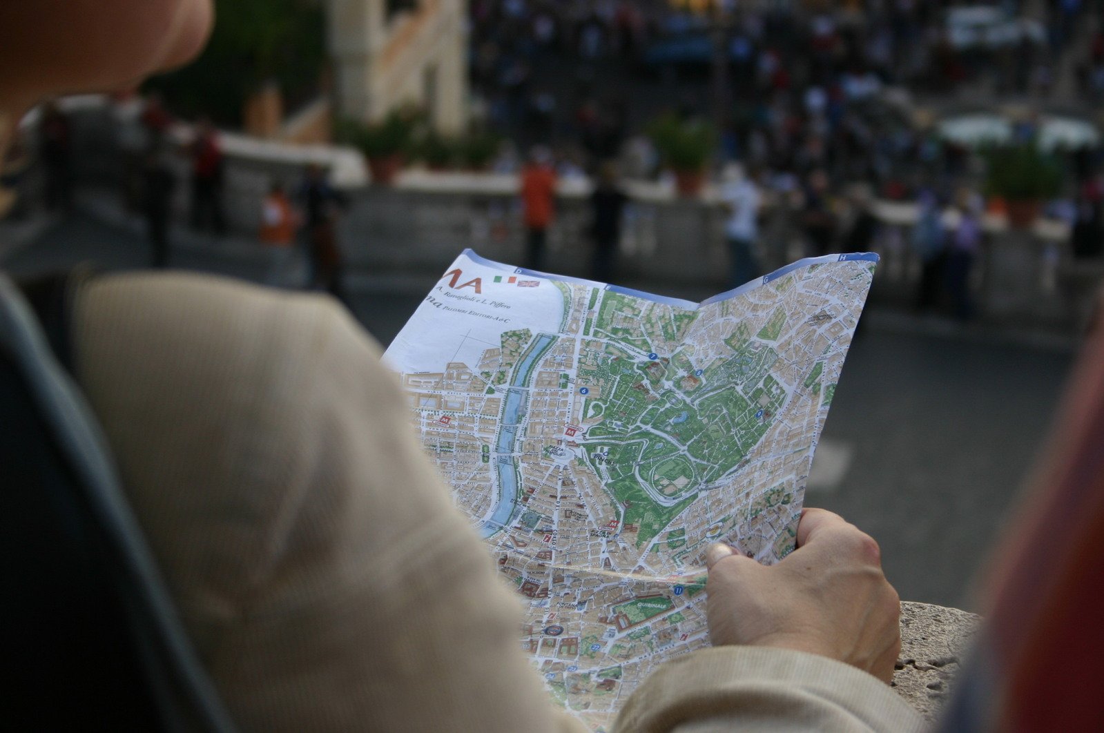 a close up of a person holding a map