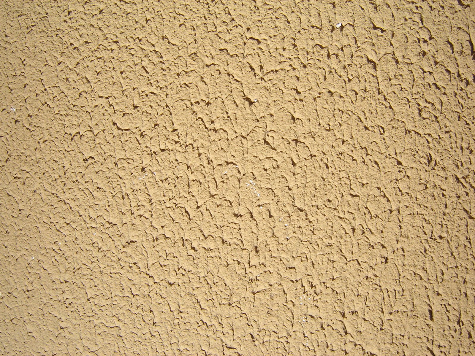 the texture of a tan wall showing the natural pattern