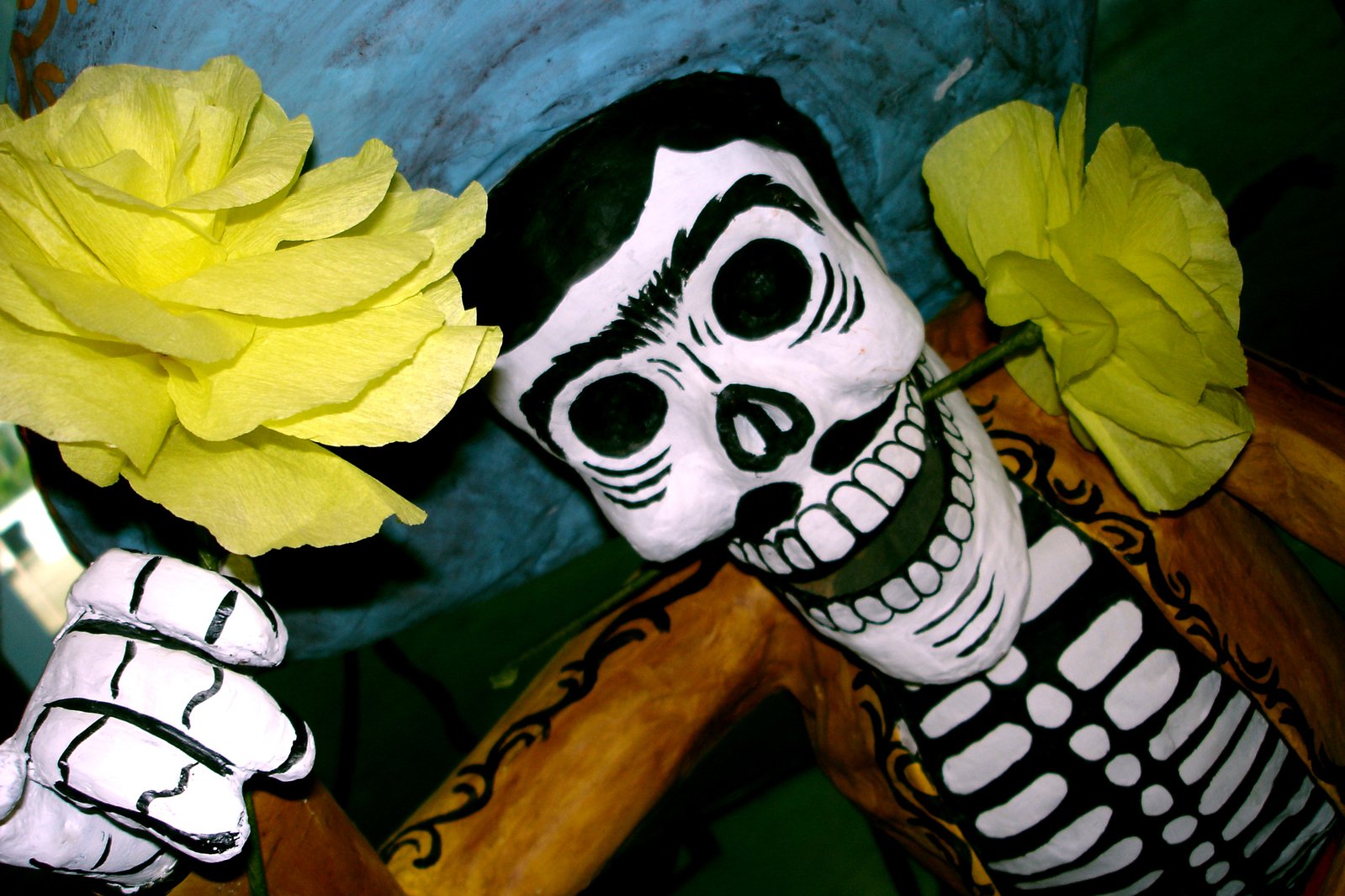 a halloween decoration of a skeleton and flowers