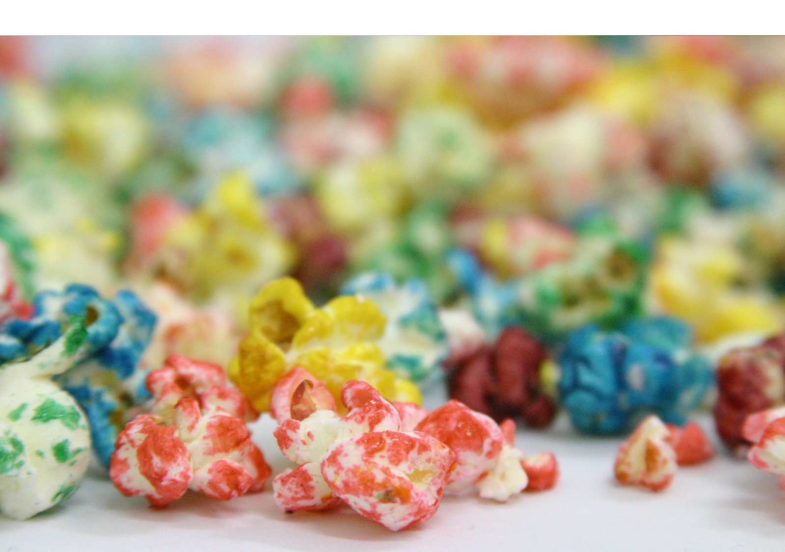 a pile of colorful popcorn sitting on top of a table