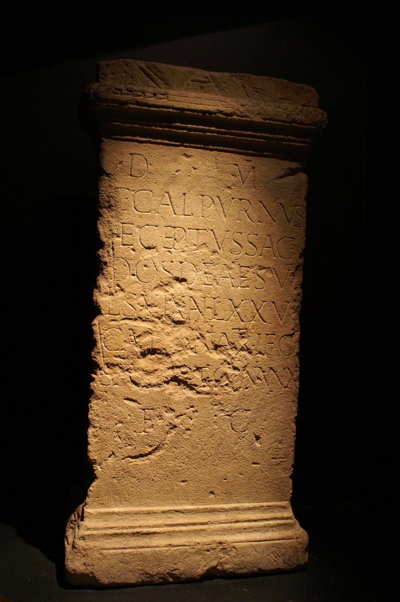 an ancient column lit up by a light