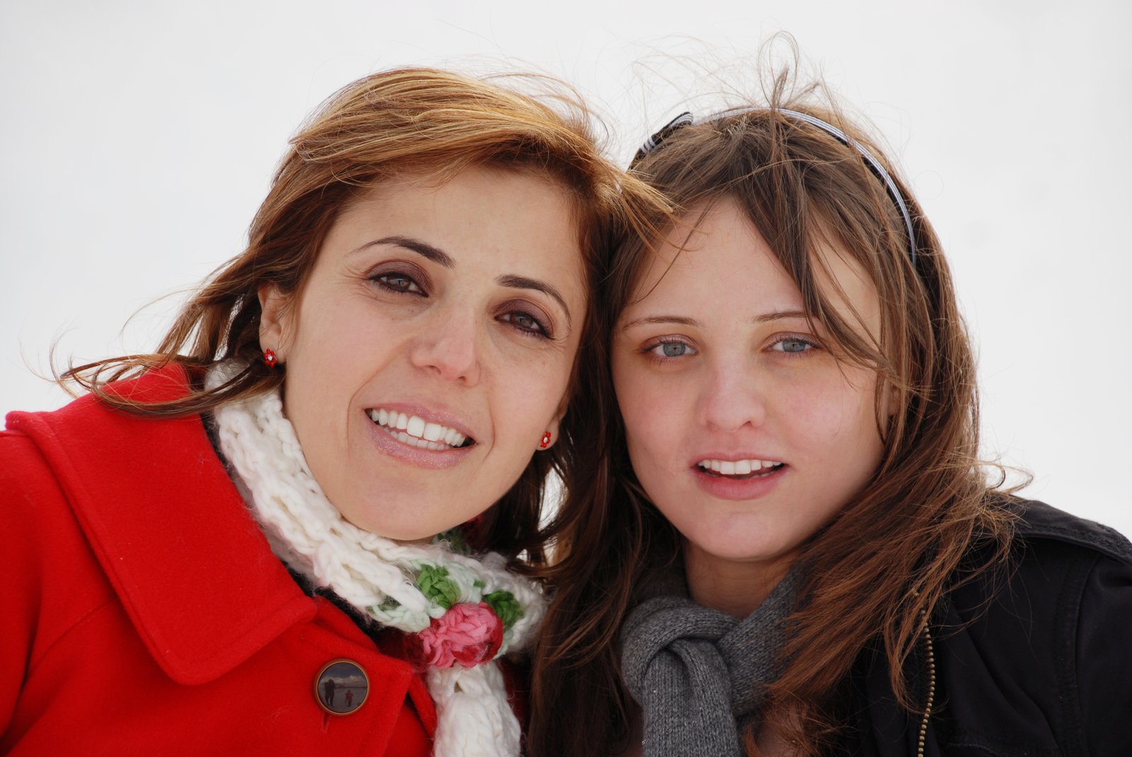 a close up of two women standing next to each other