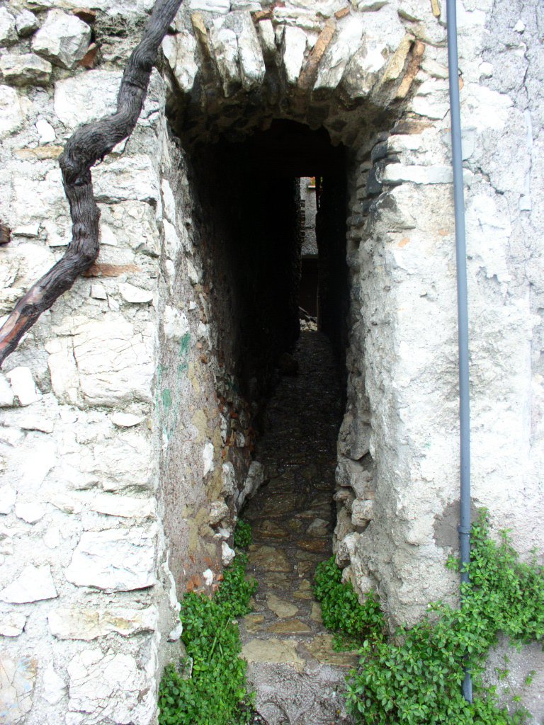 there is a small tunnel in the stone wall