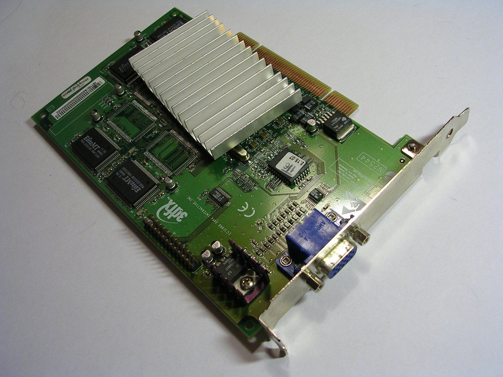 there is a small green computer card with a red and blue pin in it