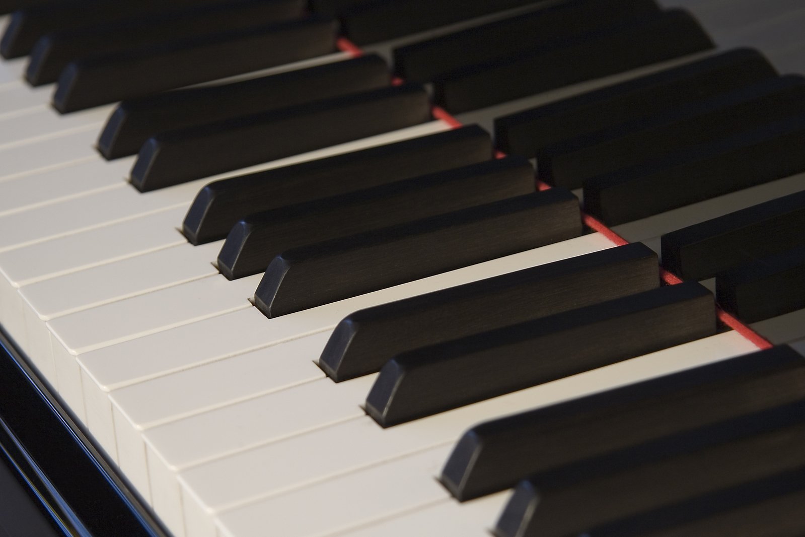 the keys of an electronic piano with black and white