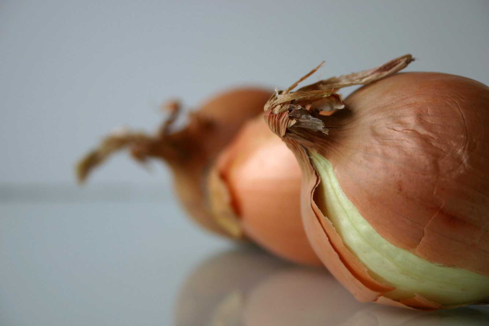a onion is half - peeled and half - empty